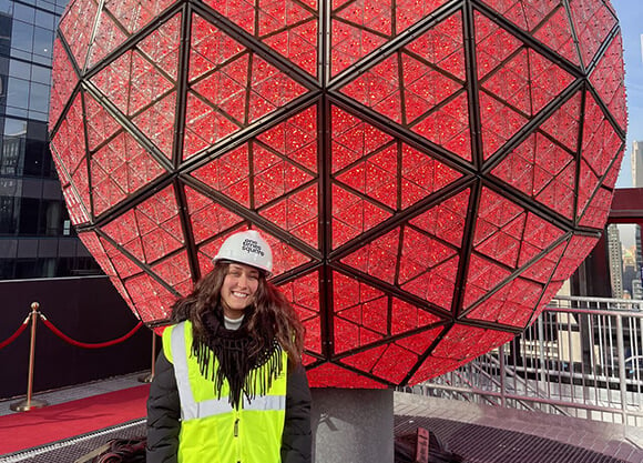 Jillian Catalano in front of the Times Square ball