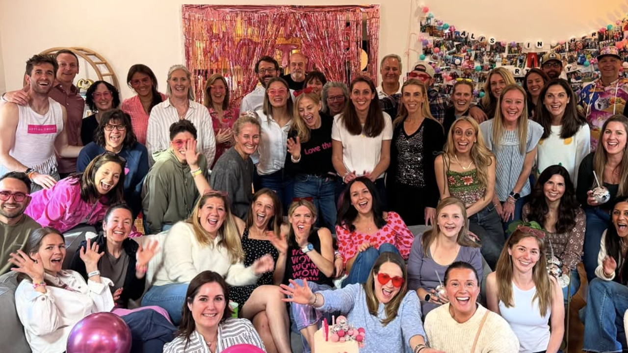 Alison Feller smiles with group of friends