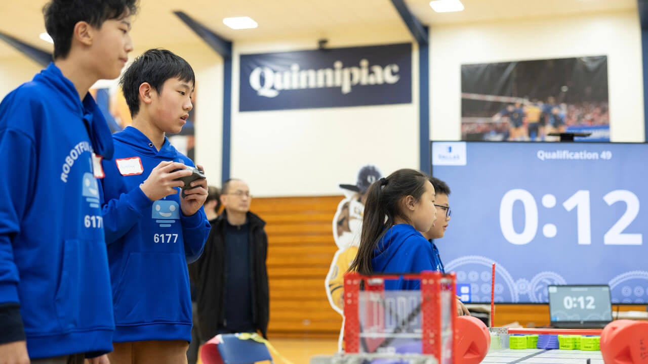 Children operating robots with 12 seconds left on the clock