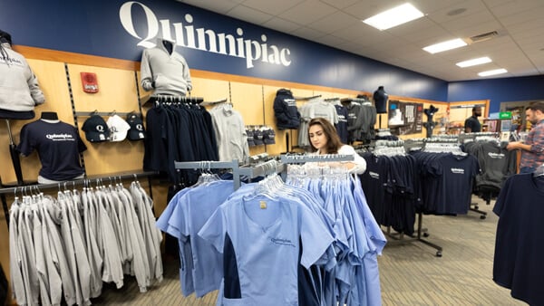 Graduate students look at merchandise in the Quinnipiac North Haven Campus bookstore