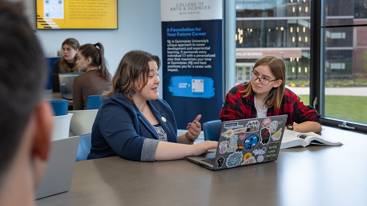 Advisor speaking with a student in the CAS Advising Suite