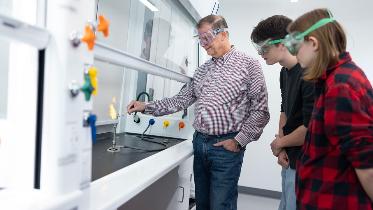 Professor demonstrating an experiment to students