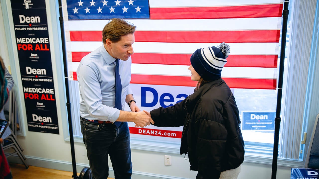 Dean Phillips shakes a Quinnipiac student's hand