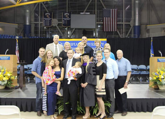 Carolyn Colley JD '13 poses with her family after graduation