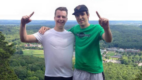 Kyle Adams and Matt Warner pose for a picture at the top of Sleeping Giant Mountain