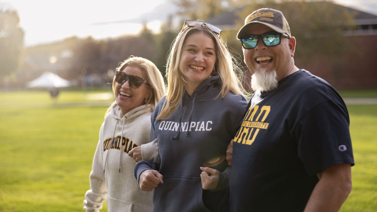 Student walks with family