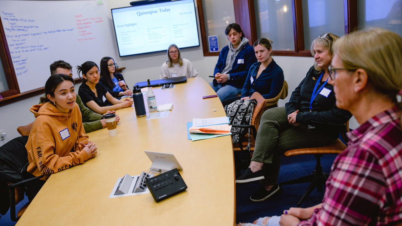 Students participating in a simulation exercise with a standardized patient.