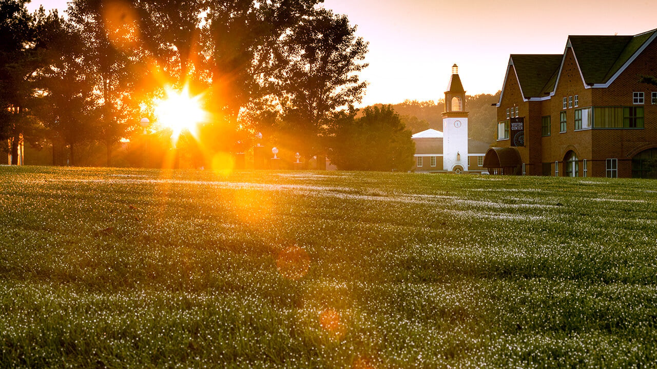 The sun rises over the Quad.