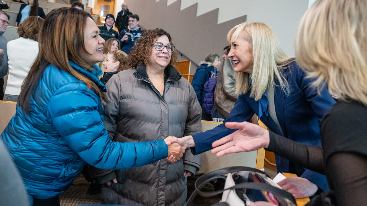 Incoming President Hardin shakes hands with individuals