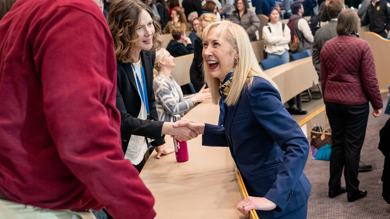 Incoming President Hardin shakes hands