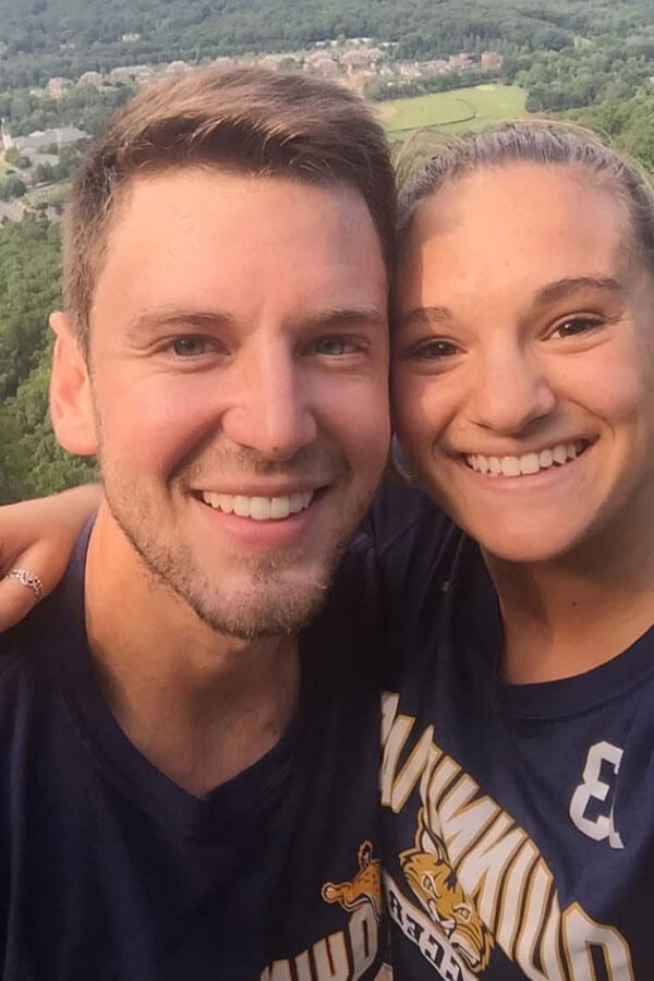 sarah pandolfi and robin schuppert smile at the top of sleeping giant