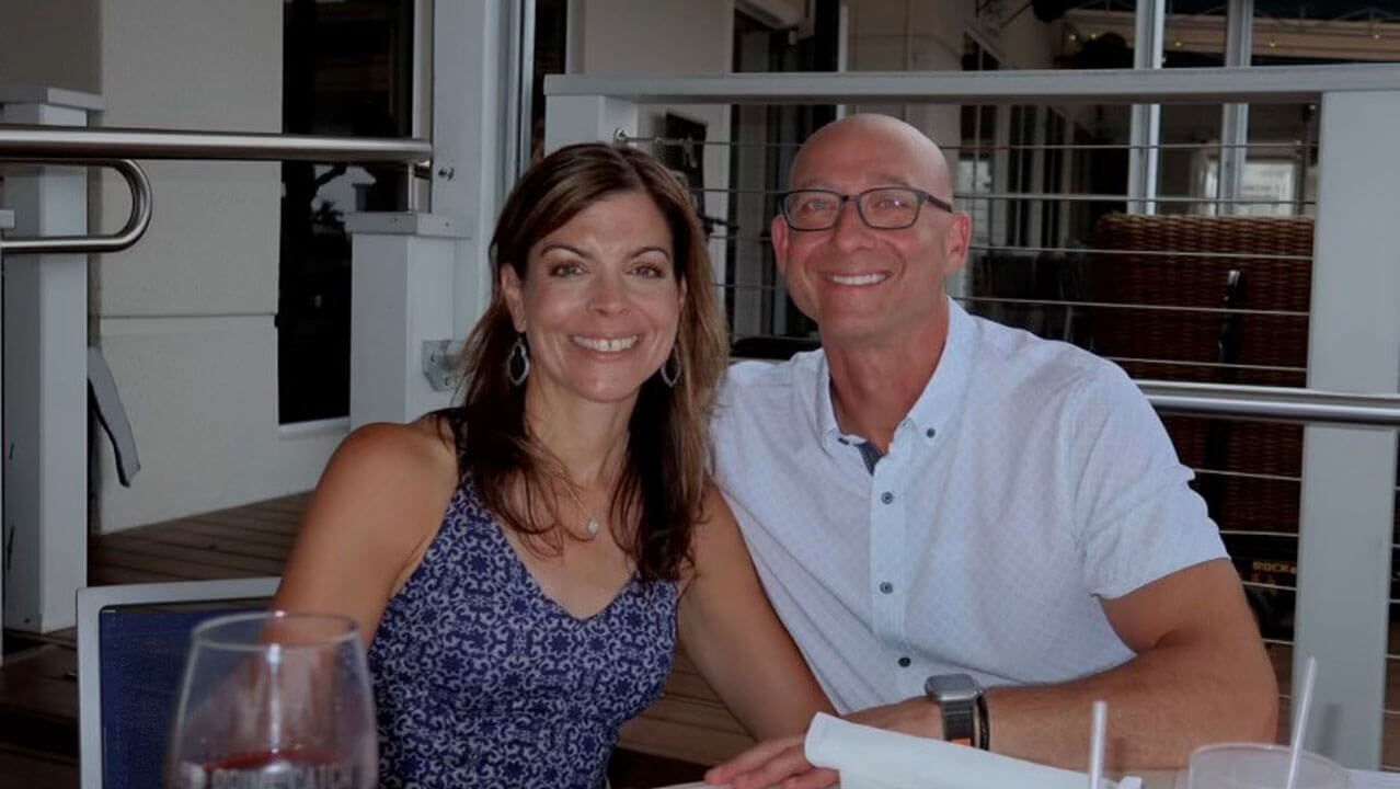 Steve and Karen Albanese smile together for a photo