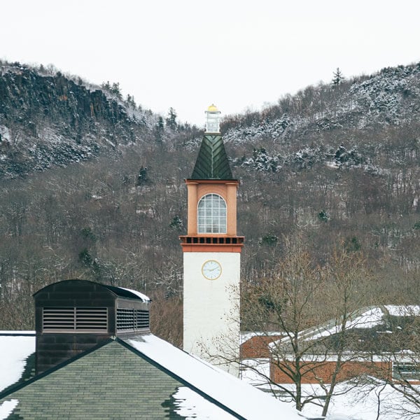 Snow covers Sleeping Giant Park with Arnold Bernhard Library in the foreground.