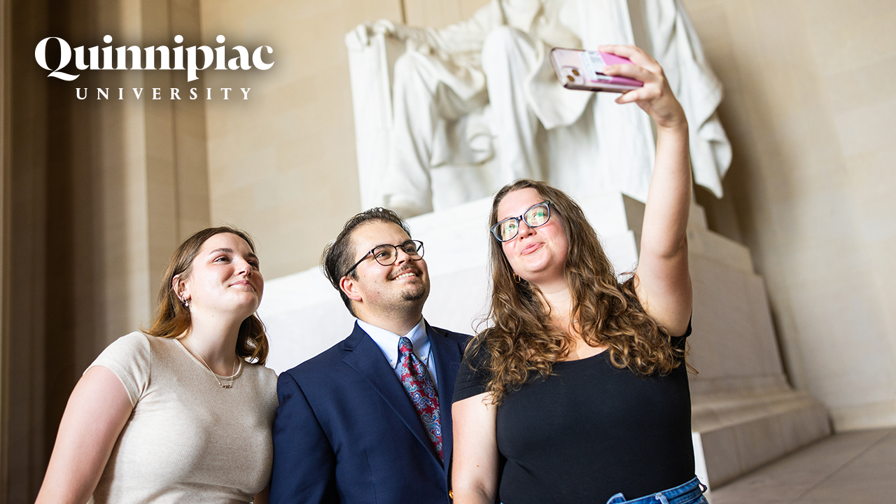 Thumbnail image of students taking a selfie in Washington DC during the QU in DC program.