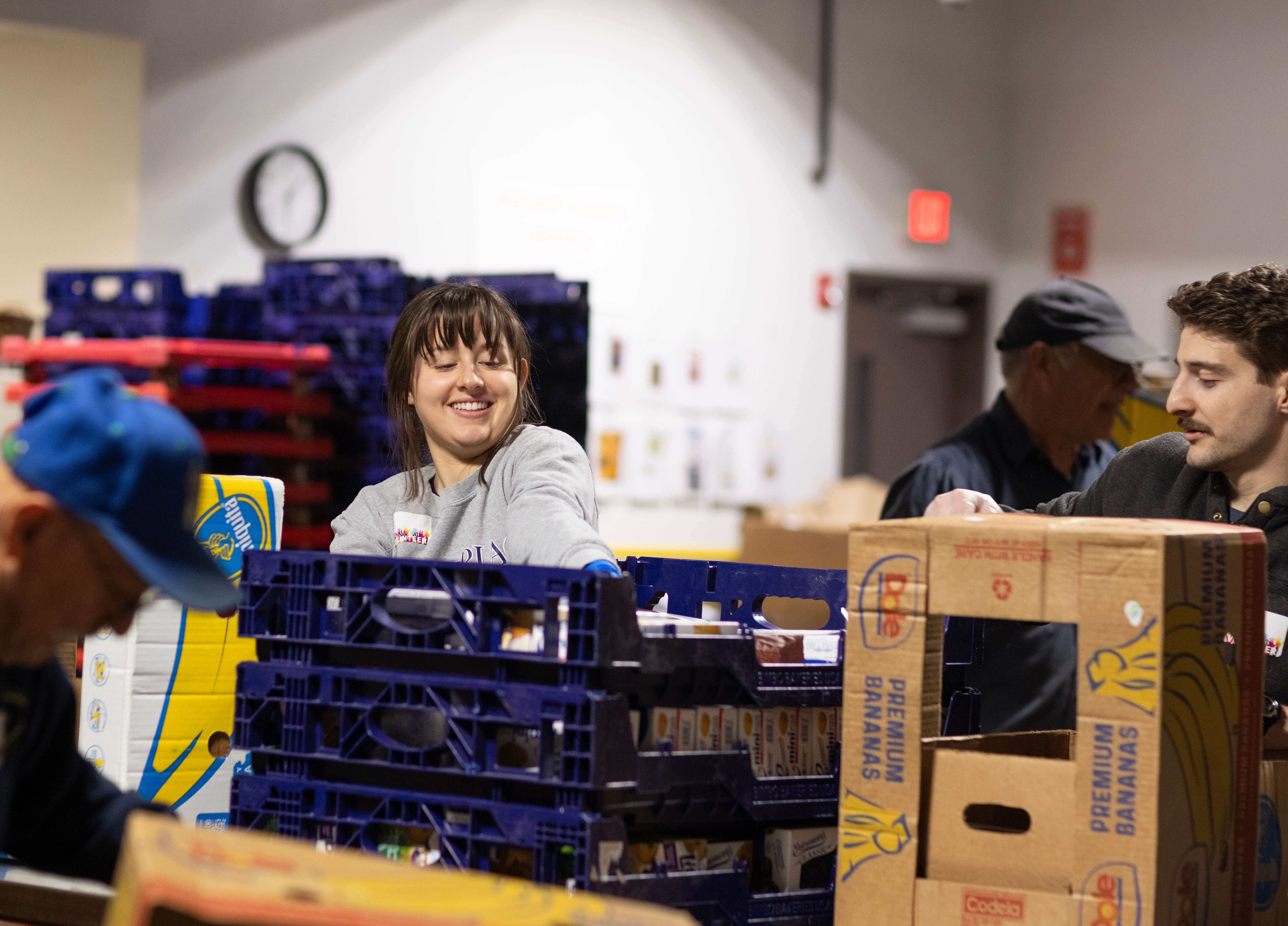 Community Action Project member packages food at the Connecticut Food Share