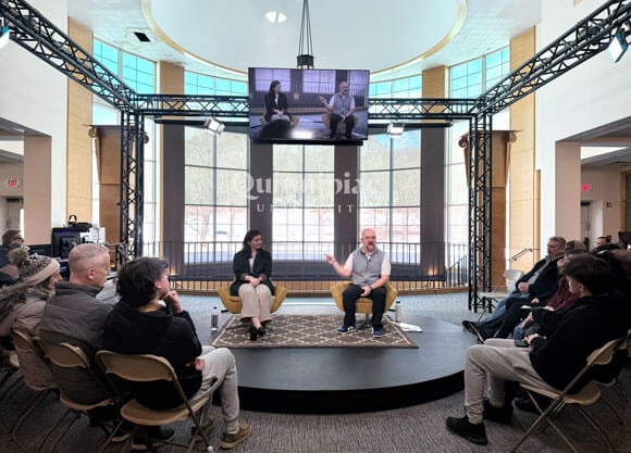 Alumna Nicole Gartner and Nick Pietruszkiewicz speak to admitted students in the open air studio.