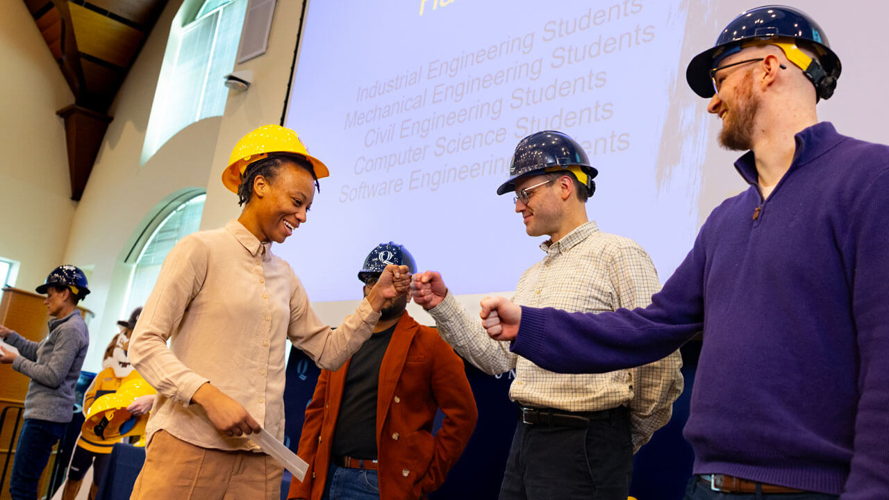 Student shakes professors hand