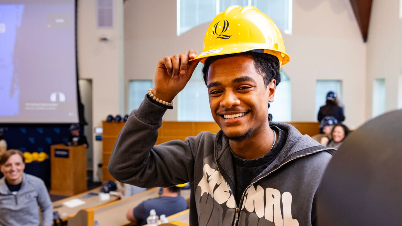 Student shows off their hard hat