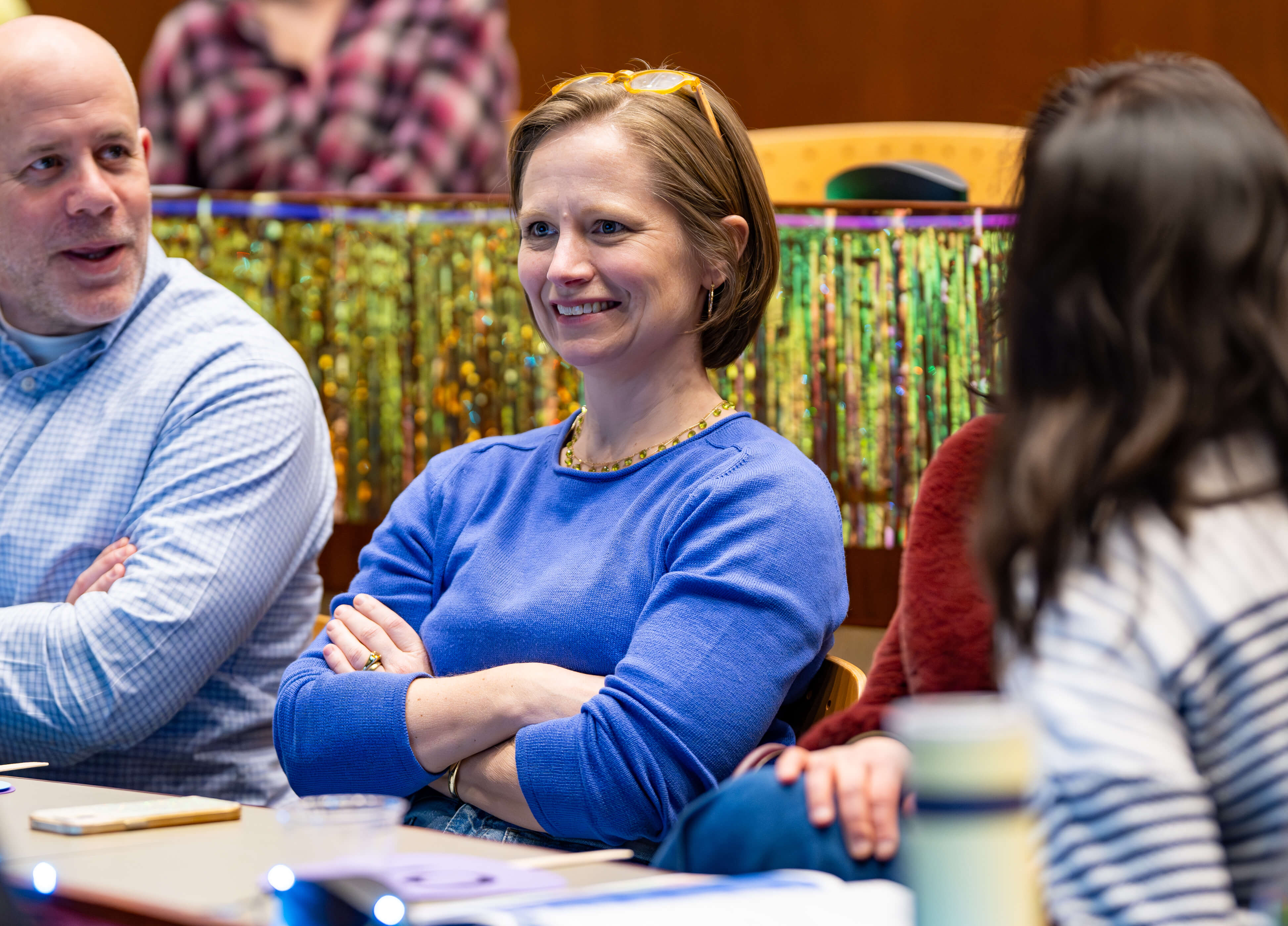 Audience member smiles at the 33rd Annual PILP Auction