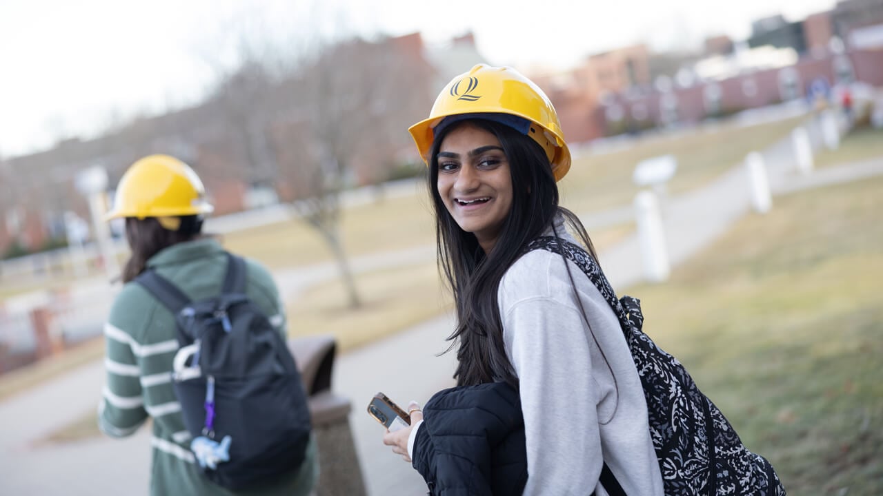 Person wearing hard hat outside