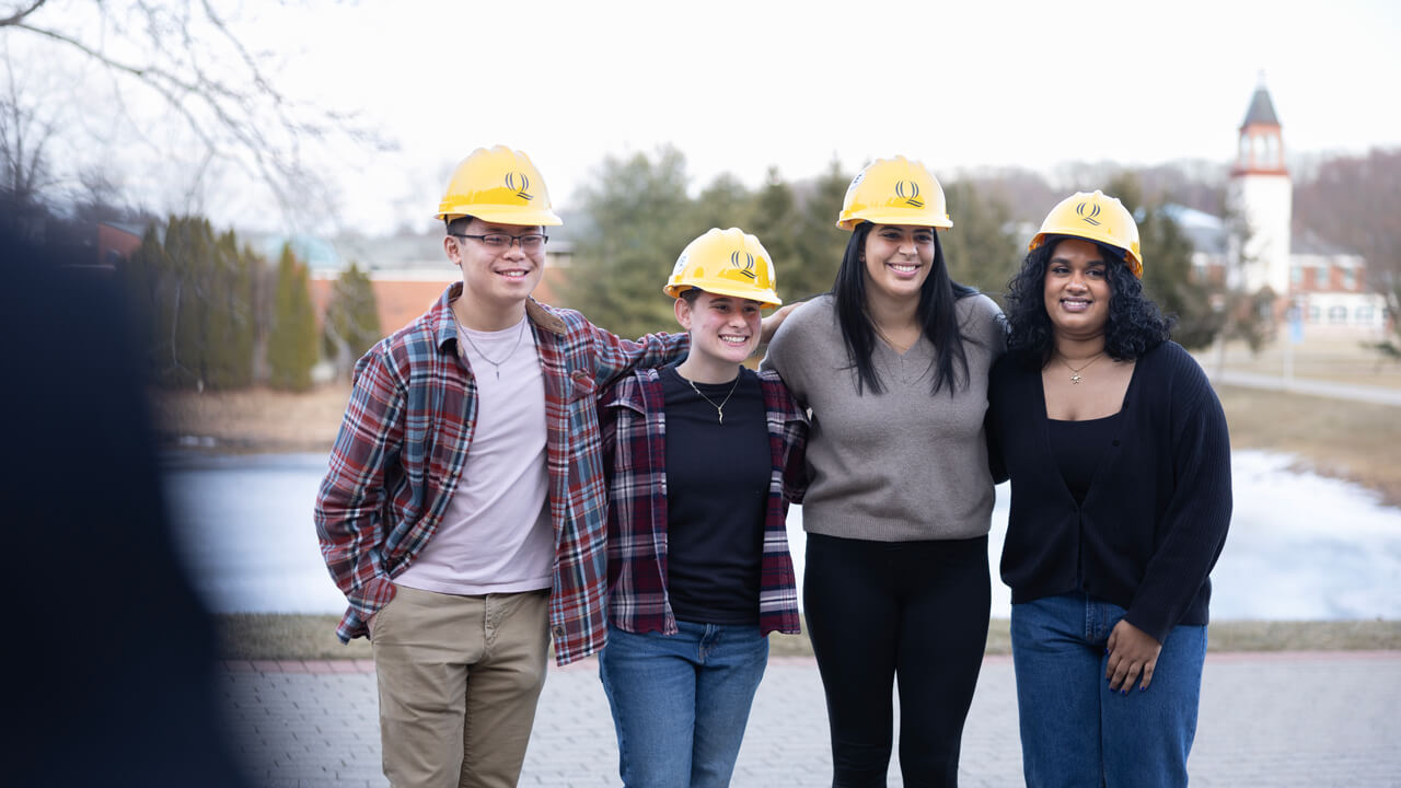 Four people pose for a photo