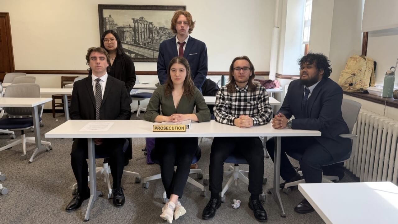 Students taking part in a mock trial as the prosecution team