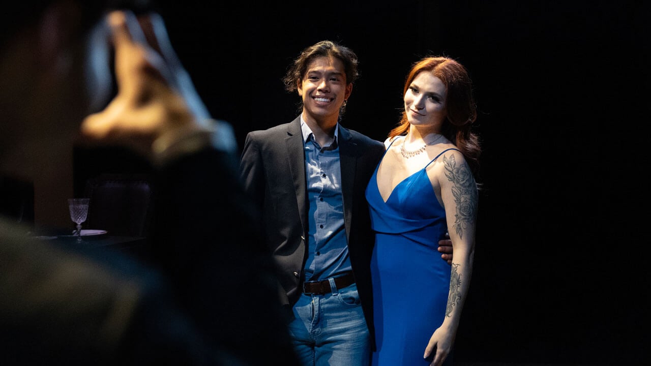 Quinnipiac students acting in spring play taking photos at prom