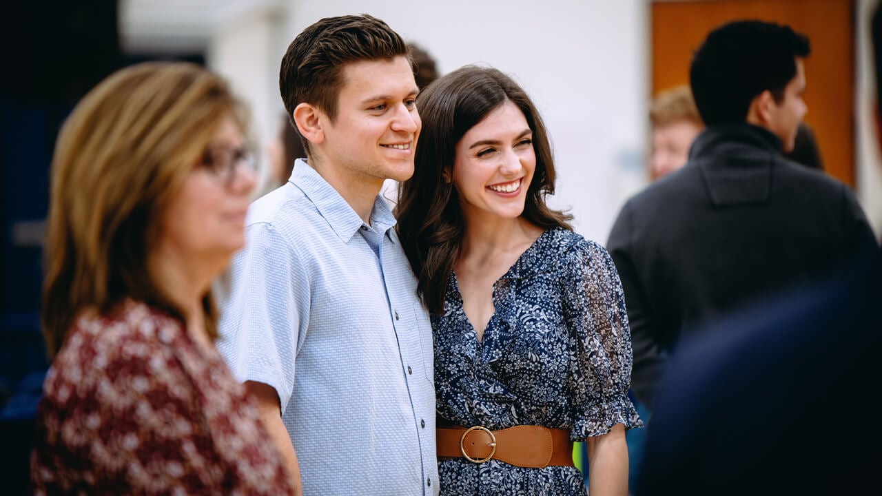 Two people pose for a photo on Match Day