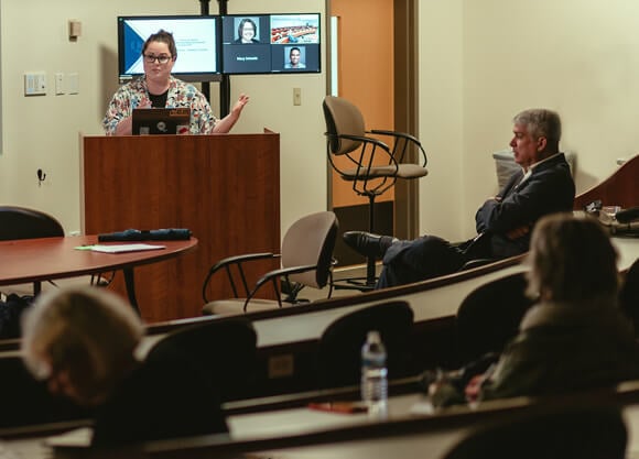 Professor gives a presentation at an assembly.