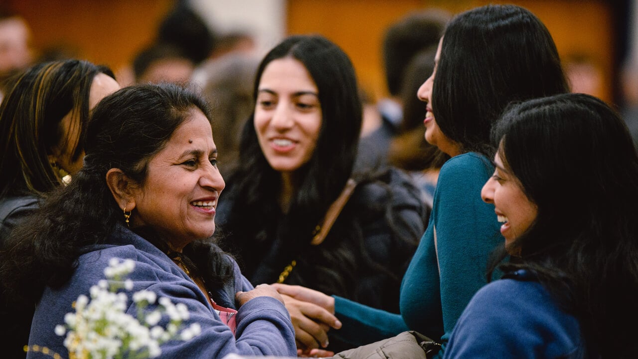 Family smiling and huddling together