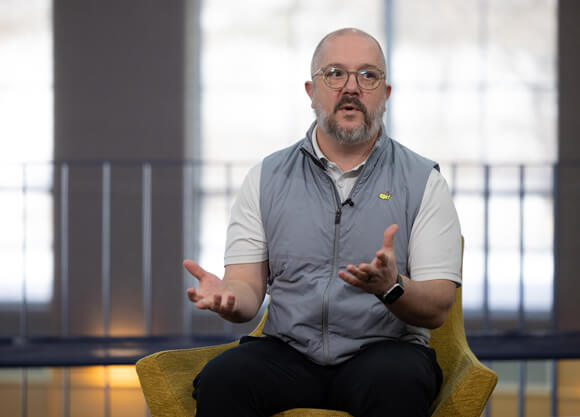 Nicholas Pietruszkiewicz sits in a chair speaking