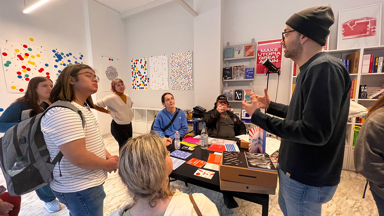 Students talk with designers at the Parco Gallery in Italy