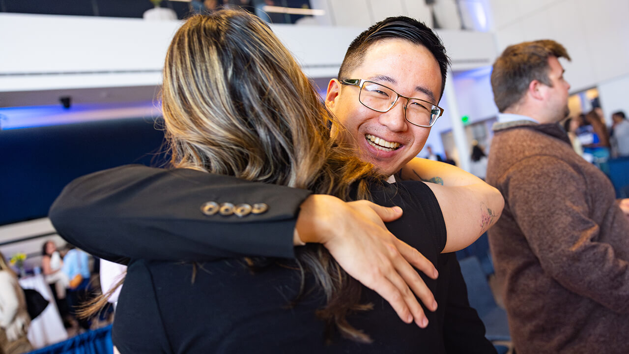 Two students embracing during Match Day