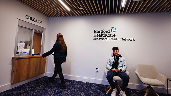 Students in the waiting room of the Counseling Center on the Mount Carmel Campus.
