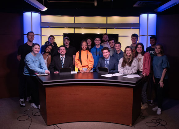 Sports Paws group in front of the new q30tv set