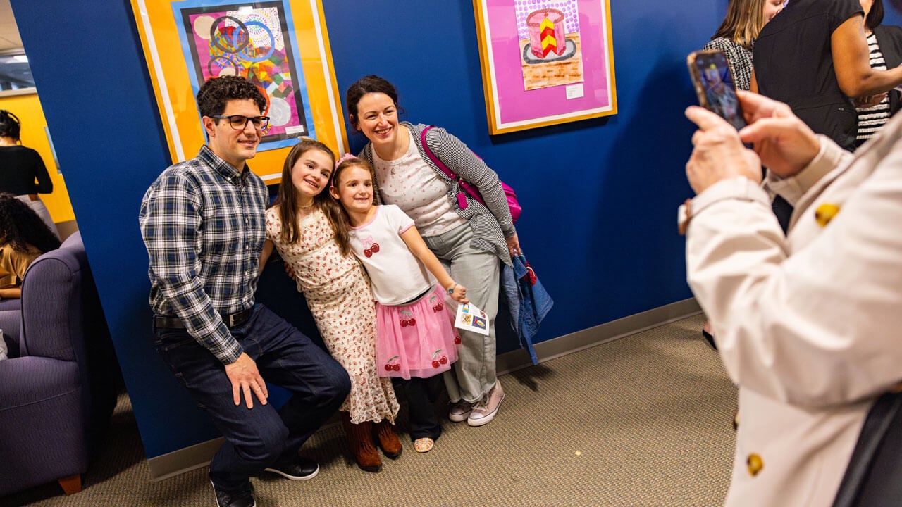 Award winning student poses with family