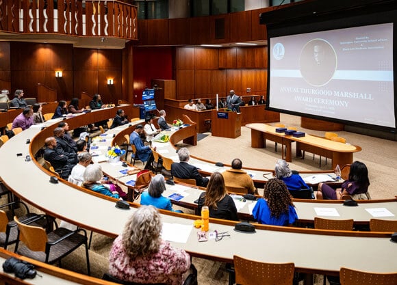 People fill the courtroom for the award ceremony