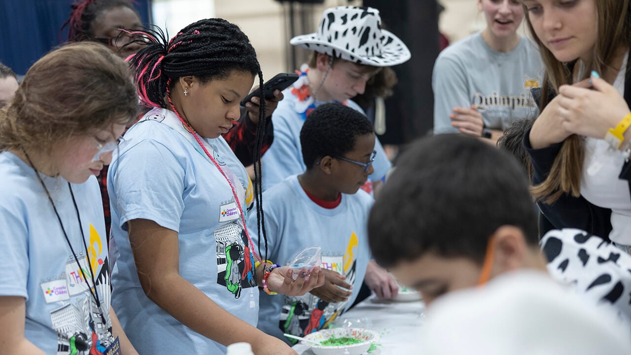 Children enjoying arts and crafts at QTHON