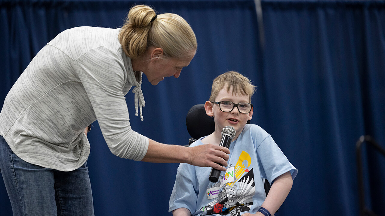 QTHON participant speaking into a microphone