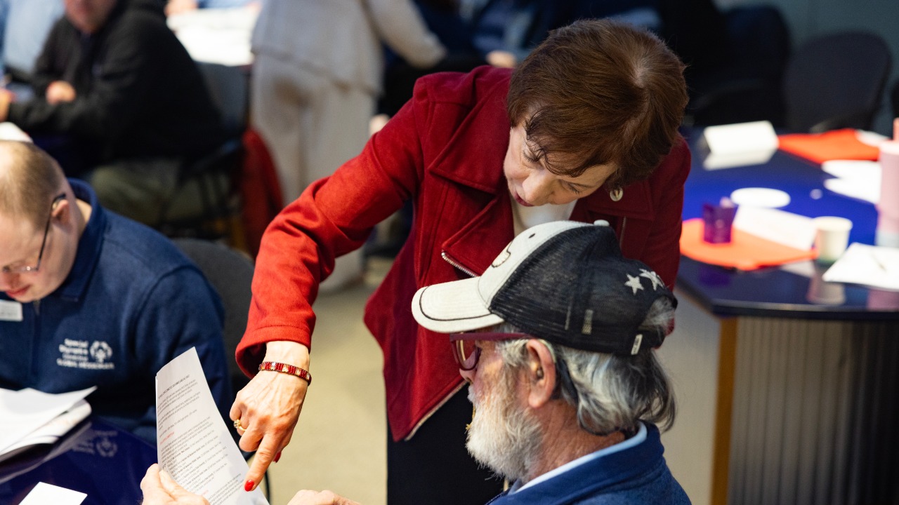 Andrea Obston and an athlete at Special Olympics Connecticut media training event