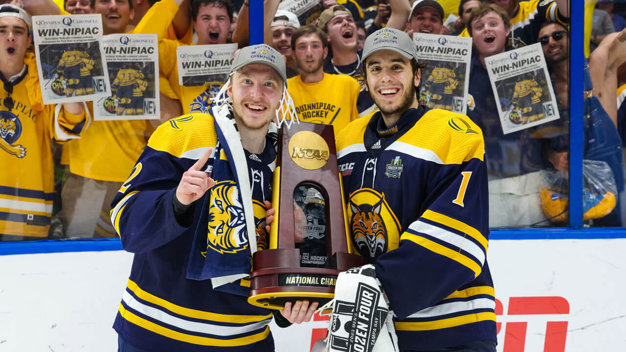 Newspapers held up behind the glass with hockey team holding up trophy