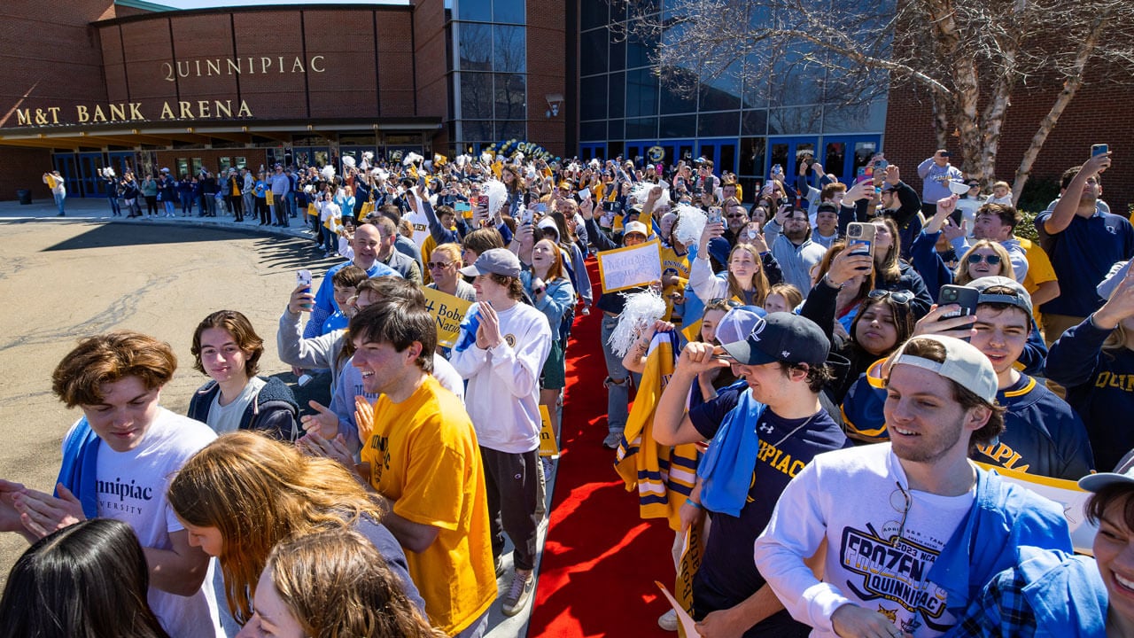 Crowd of fans waiting for the hockey team to arrive