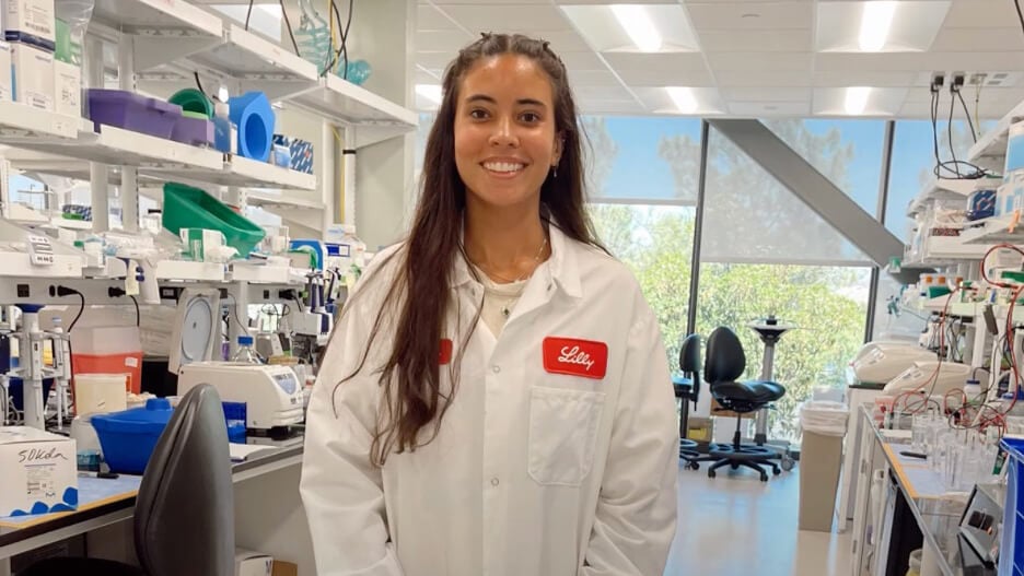 Brianna Reed takes a photo in a laboratory environment.