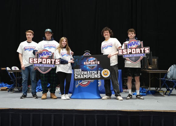 Esports Club at Quinnipiac holds up MAAC Champions sign