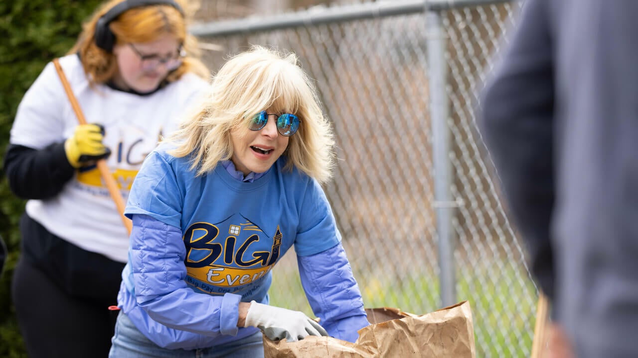 President Judy Olian spreads mulch