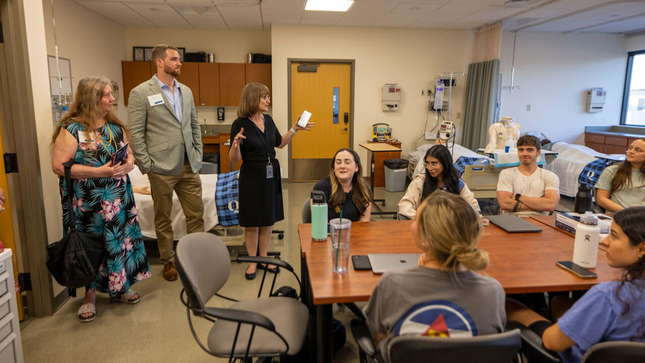 Participants adress a classroom of students