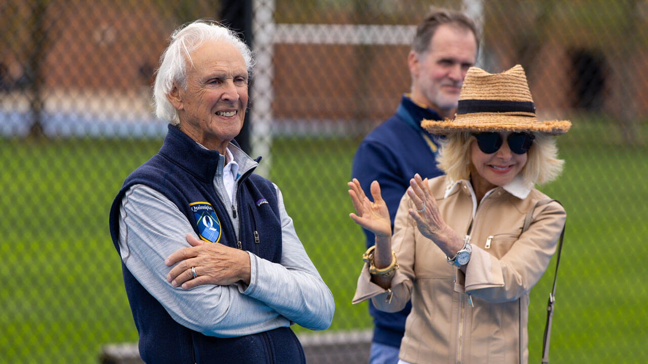 Peter Liberti and Judy Olian clapping