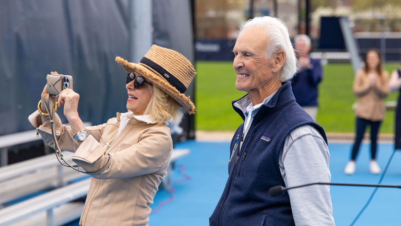 Judy Olian taking a photo with Peter Liberti