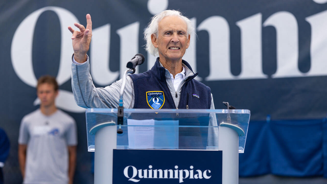 Peter Liberti smiling at the podium