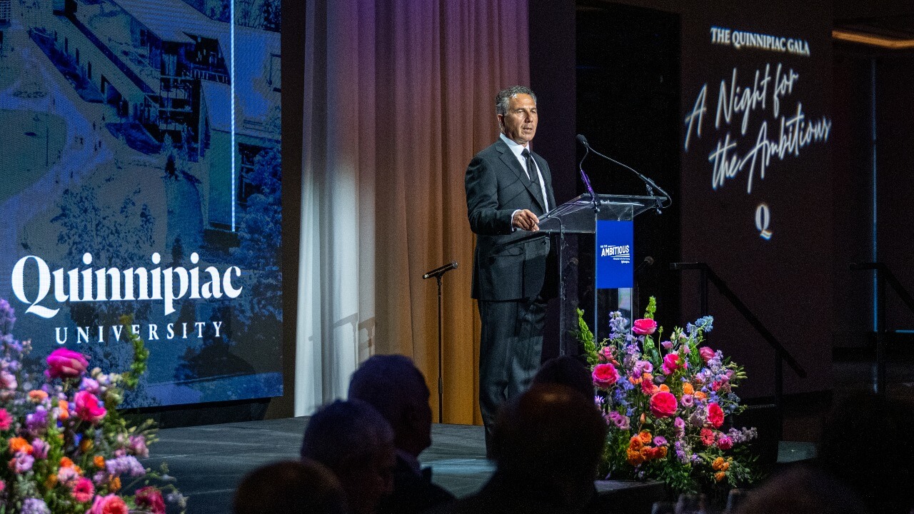 Speaker at the podium at the Quinnipiac Gala